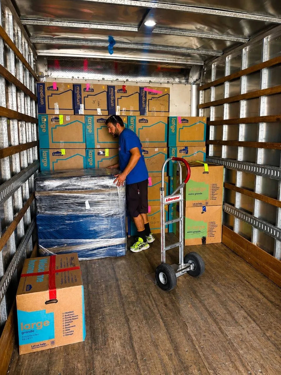 Protected furniture and moving boxes arranged inside a Southwest Van Lines truck
