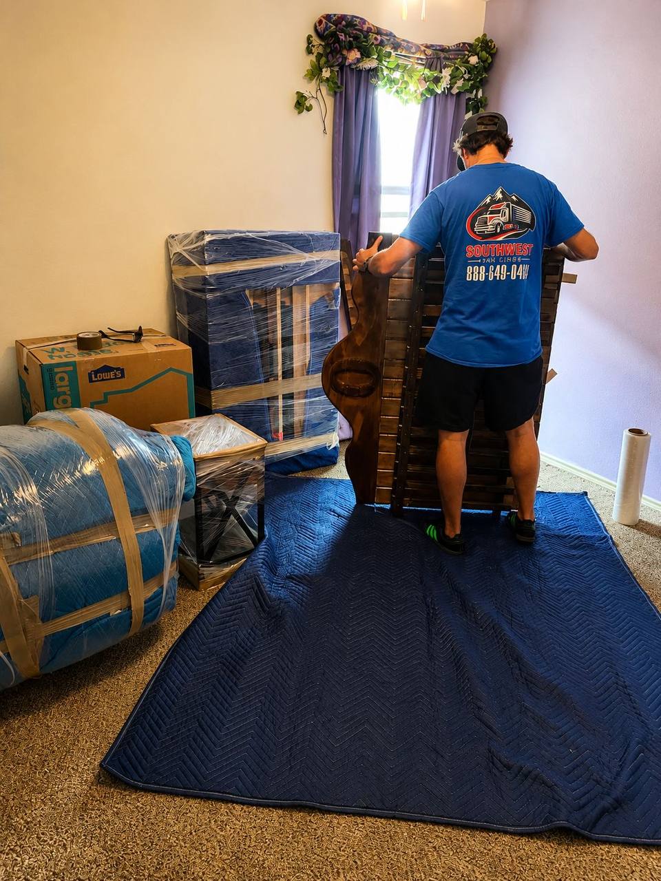 Moving boxes and protected furniture prepared for household transportation